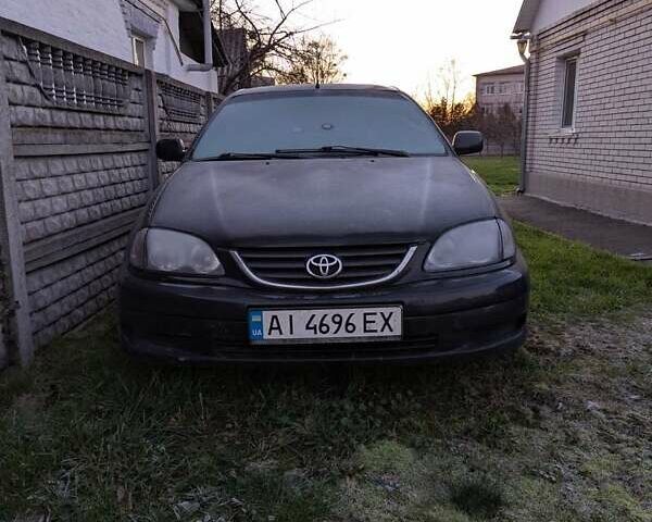 Черный Тойота Авенсис, объемом двигателя 2 л и пробегом 300 тыс. км за 3500 $, фото 1 на Automoto.ua