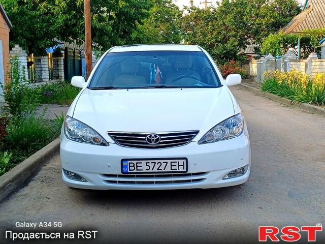 Білий Тойота Камрі, об'ємом двигуна 2.4 л та пробігом 255 тис. км за 5300 $, фото 1 на Automoto.ua