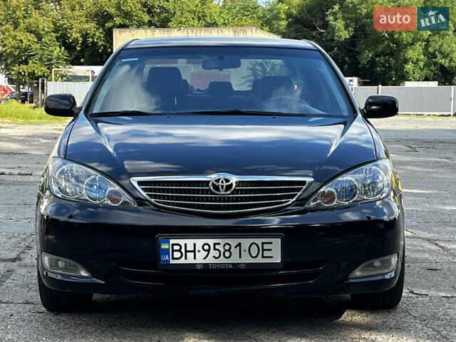 Черный Тойота Камри, объемом двигателя 3 л и пробегом 320 тыс. км за 5100 $, фото 1 на Automoto.ua