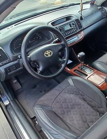 Чорний Тойота Камрі, об'ємом двигуна 2.4 л та пробігом 300 тис. км за 5200 $, фото 1 на Automoto.ua