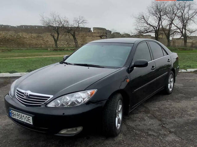 Черный Тойота Камри, объемом двигателя 3 л и пробегом 325 тыс. км за 6000 $, фото 1 на Automoto.ua