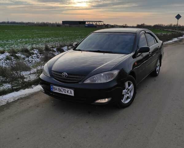 Черный Тойота Камри, объемом двигателя 3 л и пробегом 399 тыс. км за 4850 $, фото 1 на Automoto.ua