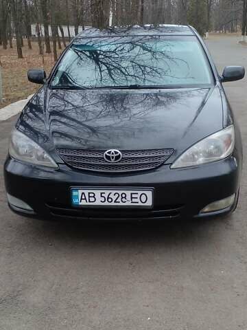 Черный Тойота Камри, объемом двигателя 2.4 л и пробегом 298 тыс. км за 5200 $, фото 1 на Automoto.ua