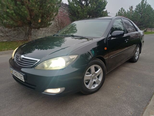 Черный Тойота Камри, объемом двигателя 2.4 л и пробегом 250 тыс. км за 5500 $, фото 1 на Automoto.ua