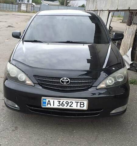 Чорний Тойота Камрі, об'ємом двигуна 2.4 л та пробігом 300 тис. км за 6500 $, фото 1 на Automoto.ua