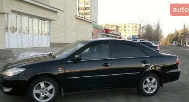 Черный Тойота Камри, объемом двигателя 2.4 л и пробегом 294 тыс. км за 7000 $, фото 1 на Automoto.ua