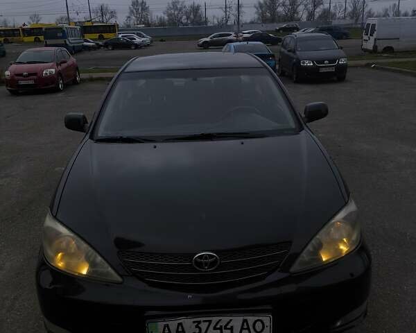 Черный Тойота Камри, объемом двигателя 2.4 л и пробегом 275 тыс. км за 4800 $, фото 1 на Automoto.ua