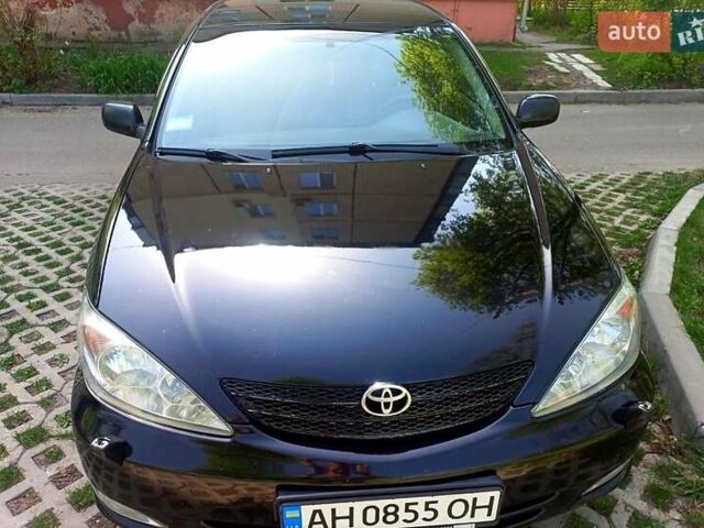 Черный Тойота Камри, объемом двигателя 2.4 л и пробегом 325 тыс. км за 5000 $, фото 1 на Automoto.ua