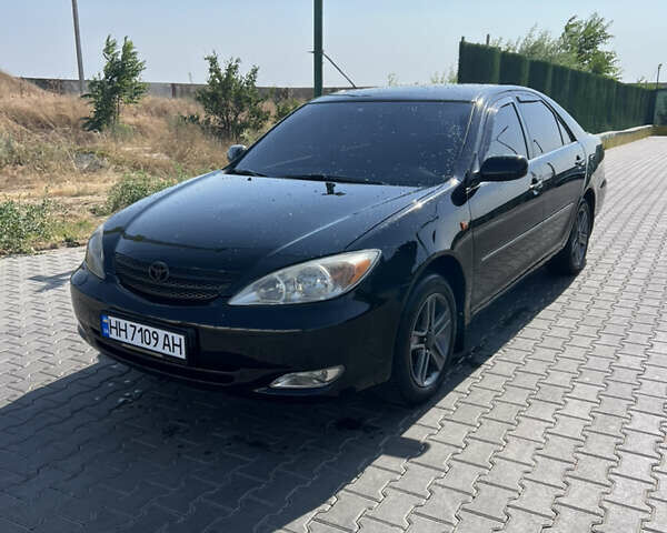 Черный Тойота Камри, объемом двигателя 2.36 л и пробегом 360 тыс. км за 5150 $, фото 1 на Automoto.ua