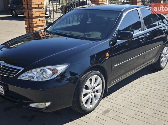 Чорний Тойота Камрі, об'ємом двигуна 2.36 л та пробігом 375 тис. км за 7600 $, фото 1 на Automoto.ua