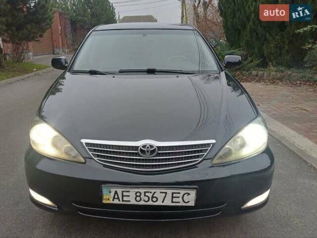 Чорний Тойота Камрі, об'ємом двигуна 2.4 л та пробігом 294 тис. км за 5200 $, фото 1 на Automoto.ua