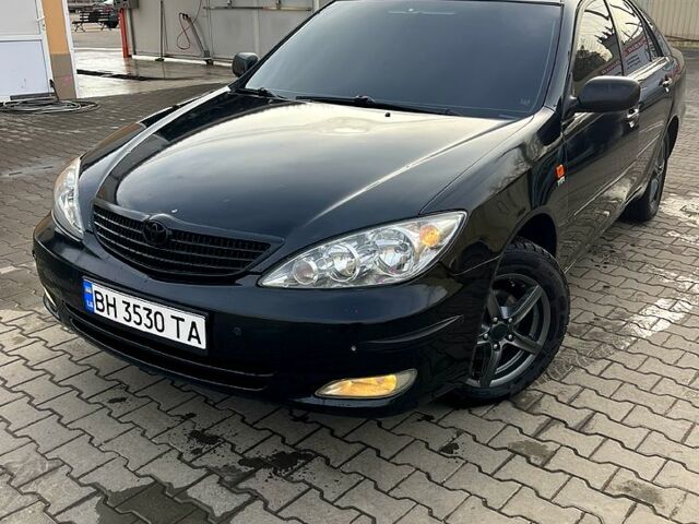 Чорний Тойота Камрі, об'ємом двигуна 2.4 л та пробігом 527 тис. км за 5200 $, фото 1 на Automoto.ua