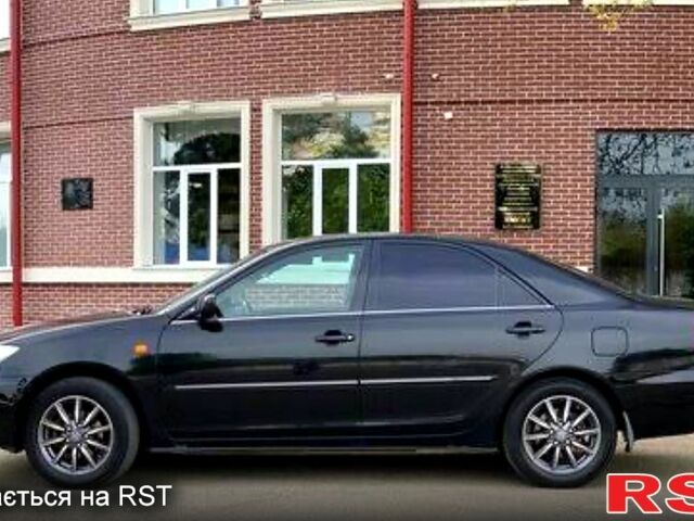 Черный Тойота Камри, объемом двигателя 2.5 л и пробегом 294 тыс. км за 7000 $, фото 1 на Automoto.ua