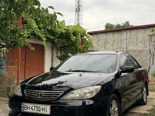 Черный Тойота Камри, объемом двигателя 2.4 л и пробегом 300 тыс. км за 3793 $, фото 1 на Automoto.ua