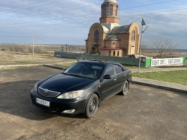 Чорний Тойота Камрі, об'ємом двигуна 2.4 л та пробігом 207 тис. км за 2900 $, фото 1 на Automoto.ua