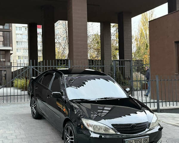 Черный Тойота Камри, объемом двигателя 2.36 л и пробегом 353 тыс. км за 6500 $, фото 1 на Automoto.ua