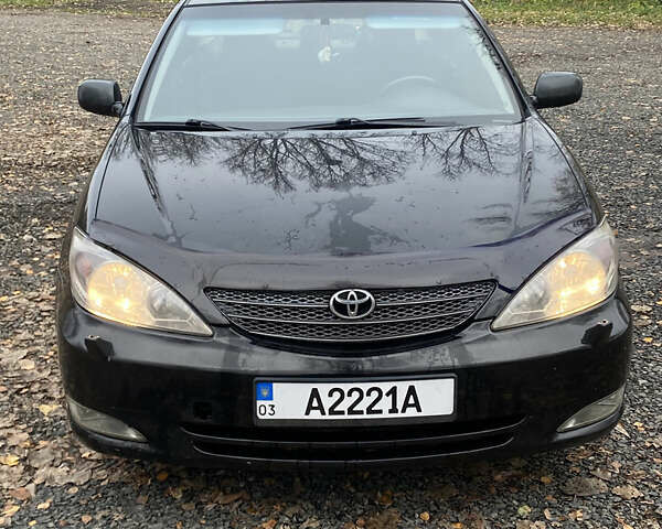 Чорний Тойота Камрі, об'ємом двигуна 2.4 л та пробігом 310 тис. км за 5600 $, фото 1 на Automoto.ua