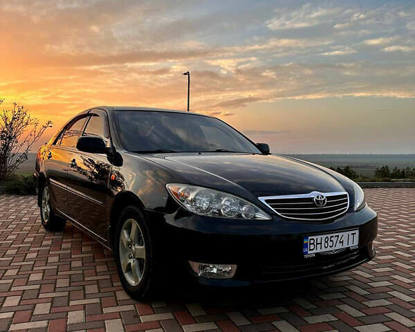 Черный Тойота Камри, объемом двигателя 3 л и пробегом 285 тыс. км за 6500 $, фото 1 на Automoto.ua