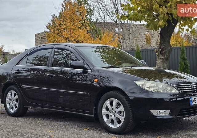 Тойота Камри 2004 в Каменское - Днепродзержинск на Automoto.ua Черный Тойота Камри, объемом двигателя 2 л и пробегом 180 тыс. км за 6700 $, фото 1 на Automoto.ua