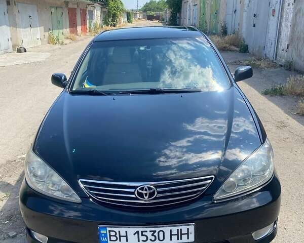 Черный Тойота Камри, объемом двигателя 2.36 л и пробегом 285 тыс. км за 6300 $, фото 1 на Automoto.ua