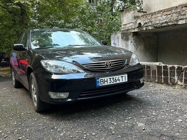 Черный Тойота Камри, объемом двигателя 2.36 л и пробегом 302 тыс. км за 6500 $, фото 1 на Automoto.ua