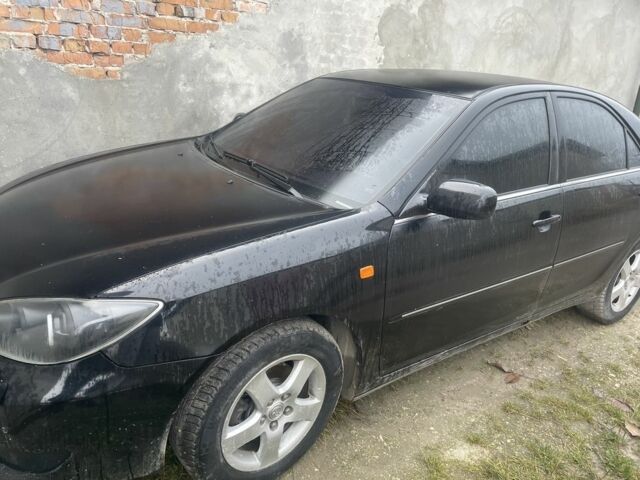 Черный Тойота Камри, объемом двигателя 3 л и пробегом 200 тыс. км за 6000 $, фото 1 на Automoto.ua