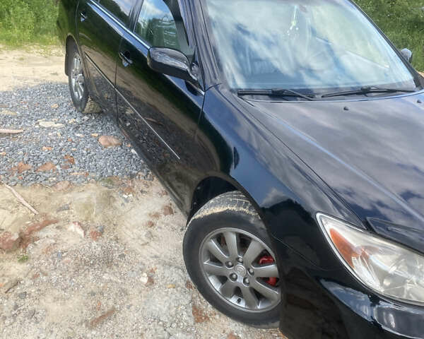 Черный Тойота Камри, объемом двигателя 2.36 л и пробегом 174 тыс. км за 5950 $, фото 1 на Automoto.ua