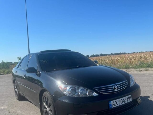 Чорний Тойота Камрі, об'ємом двигуна 2.4 л та пробігом 240 тис. км за 6200 $, фото 1 на Automoto.ua