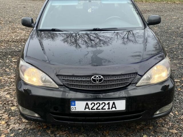Черный Тойота Камри, объемом двигателя 2.4 л и пробегом 310 тыс. км за 5600 $, фото 1 на Automoto.ua
