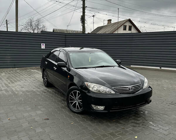 Чорний Тойота Камрі, об'ємом двигуна 2.4 л та пробігом 292 тис. км за 5350 $, фото 1 на Automoto.ua