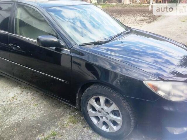 Чорний Тойота Камрі, об'ємом двигуна 3 л та пробігом 208 тис. км за 6700 $, фото 1 на Automoto.ua