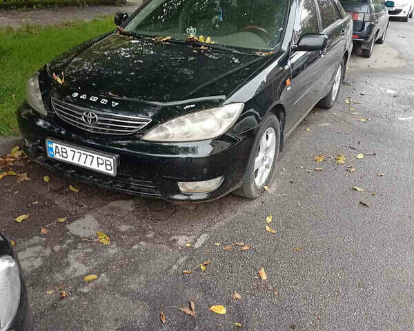 Черный Тойота Камри, объемом двигателя 2.36 л и пробегом 350 тыс. км за 4500 $, фото 1 на Automoto.ua