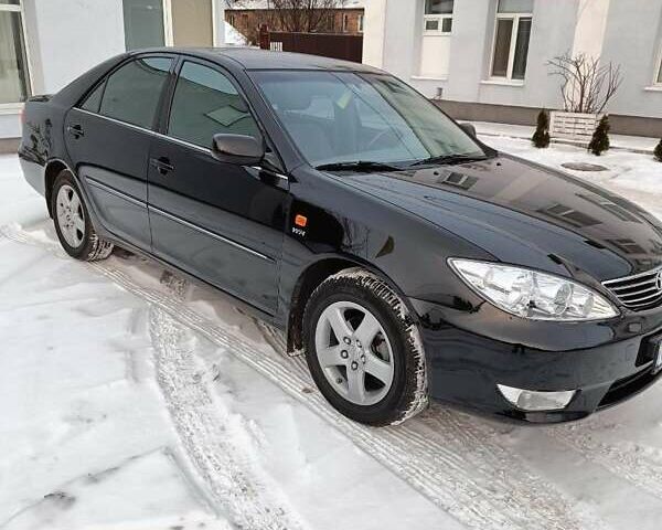Чорний Тойота Камрі, об'ємом двигуна 2.4 л та пробігом 85 тис. км за 10900 $, фото 1 на Automoto.ua