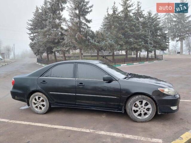 Чорний Тойота Камрі, об'ємом двигуна 3 л та пробігом 267 тис. км за 7500 $, фото 1 на Automoto.ua