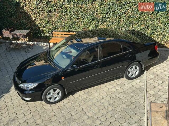 Черный Тойота Камри, объемом двигателя 2.36 л и пробегом 253 тыс. км за 6900 $, фото 1 на Automoto.ua