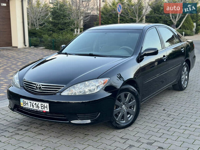 Черный Тойота Камри, объемом двигателя 2.36 л и пробегом 98 тыс. км за 8700 $, фото 1 на Automoto.ua