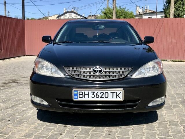 Черный Тойота Камри, объемом двигателя 2.4 л и пробегом 310 тыс. км за 5000 $, фото 1 на Automoto.ua