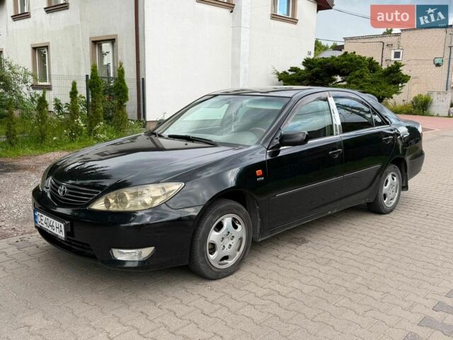 Черный Тойота Камри, объемом двигателя 2.4 л и пробегом 281 тыс. км за 3999 $, фото 1 на Automoto.ua