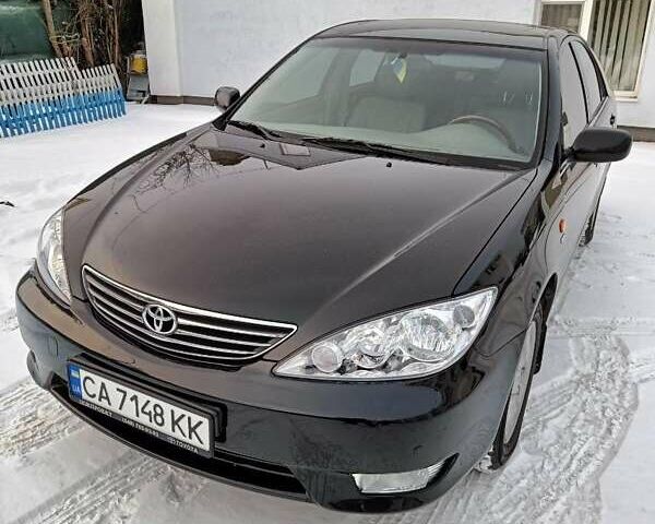 Черный Тойота Камри, объемом двигателя 2.4 л и пробегом 85 тыс. км за 10800 $, фото 1 на Automoto.ua