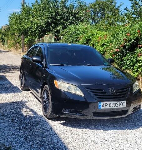 Черный Тойота Камри, объемом двигателя 3.5 л и пробегом 300 тыс. км за 7500 $, фото 1 на Automoto.ua