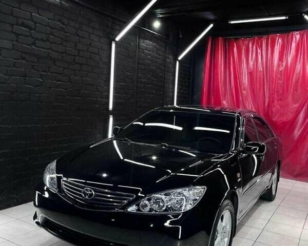 Чорний Тойота Камрі, об'ємом двигуна 2.36 л та пробігом 270 тис. км за 6100 $, фото 1 на Automoto.ua