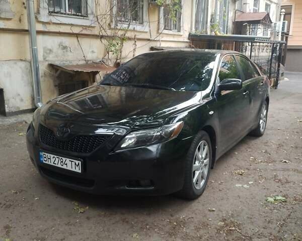 Черный Тойота Камри, объемом двигателя 3.5 л и пробегом 200 тыс. км за 6000 $, фото 1 на Automoto.ua