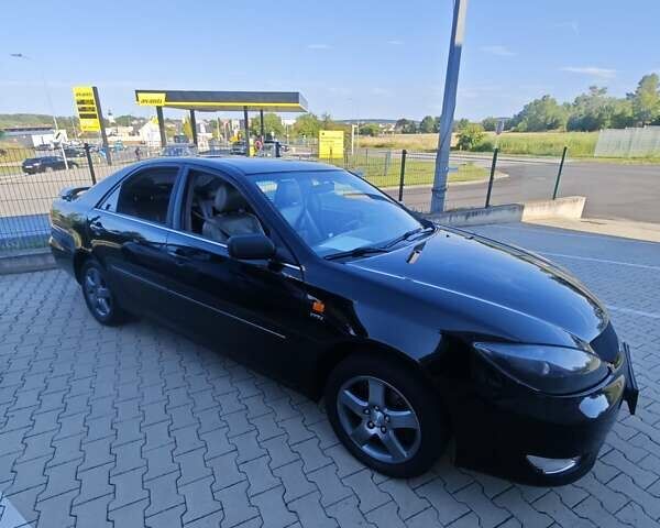 Черный Тойота Камри, объемом двигателя 2.36 л и пробегом 445 тыс. км за 6100 $, фото 1 на Automoto.ua