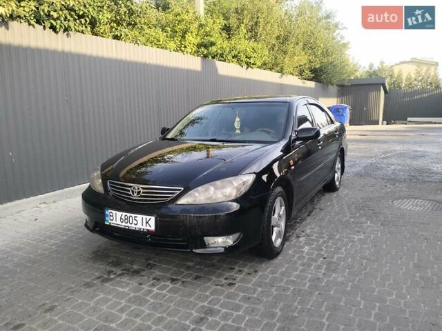 Чорний Тойота Камрі, об'ємом двигуна 2.4 л та пробігом 313 тис. км за 7200 $, фото 1 на Automoto.ua