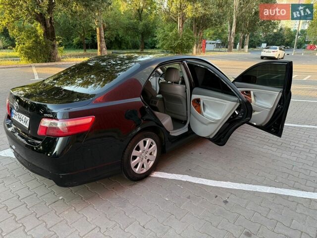 Чорний Тойота Камрі, об'ємом двигуна 2.4 л та пробігом 240 тис. км за 7400 $, фото 1 на Automoto.ua
