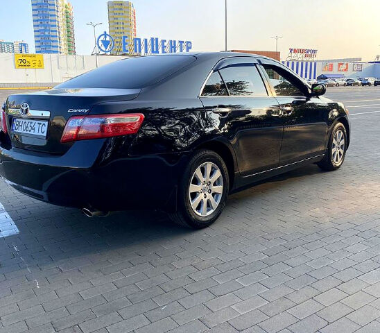 Черный Тойота Камри, объемом двигателя 2.4 л и пробегом 235 тыс. км за 8000 $, фото 1 на Automoto.ua