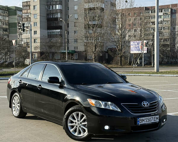 Черный Тойота Камри, объемом двигателя 3.5 л и пробегом 235 тыс. км за 8300 $, фото 1 на Automoto.ua