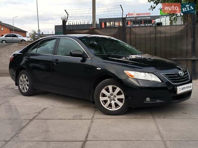 Черный Тойота Камри, объемом двигателя 2.4 л и пробегом 304 тыс. км за 6990 $, фото 1 на Automoto.ua