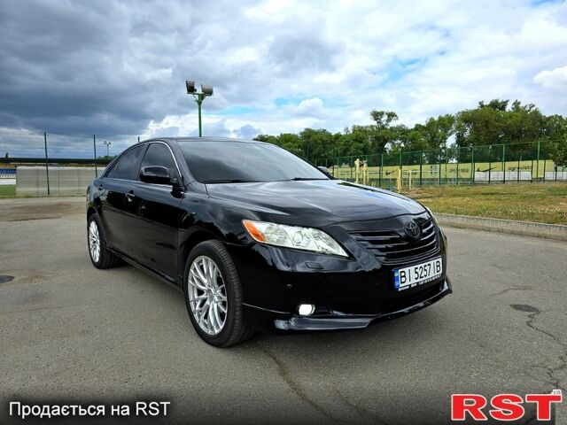 Черный Тойота Камри, объемом двигателя 2.4 л и пробегом 290 тыс. км за 8500 $, фото 1 на Automoto.ua