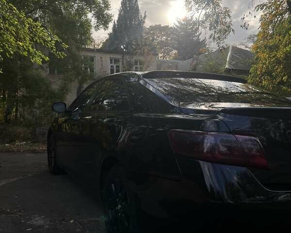 Чорний Тойота Камрі, об'ємом двигуна 2.36 л та пробігом 335 тис. км за 7700 $, фото 1 на Automoto.ua